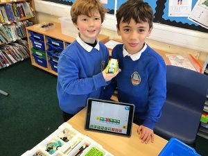 2 pupils using IT equipment